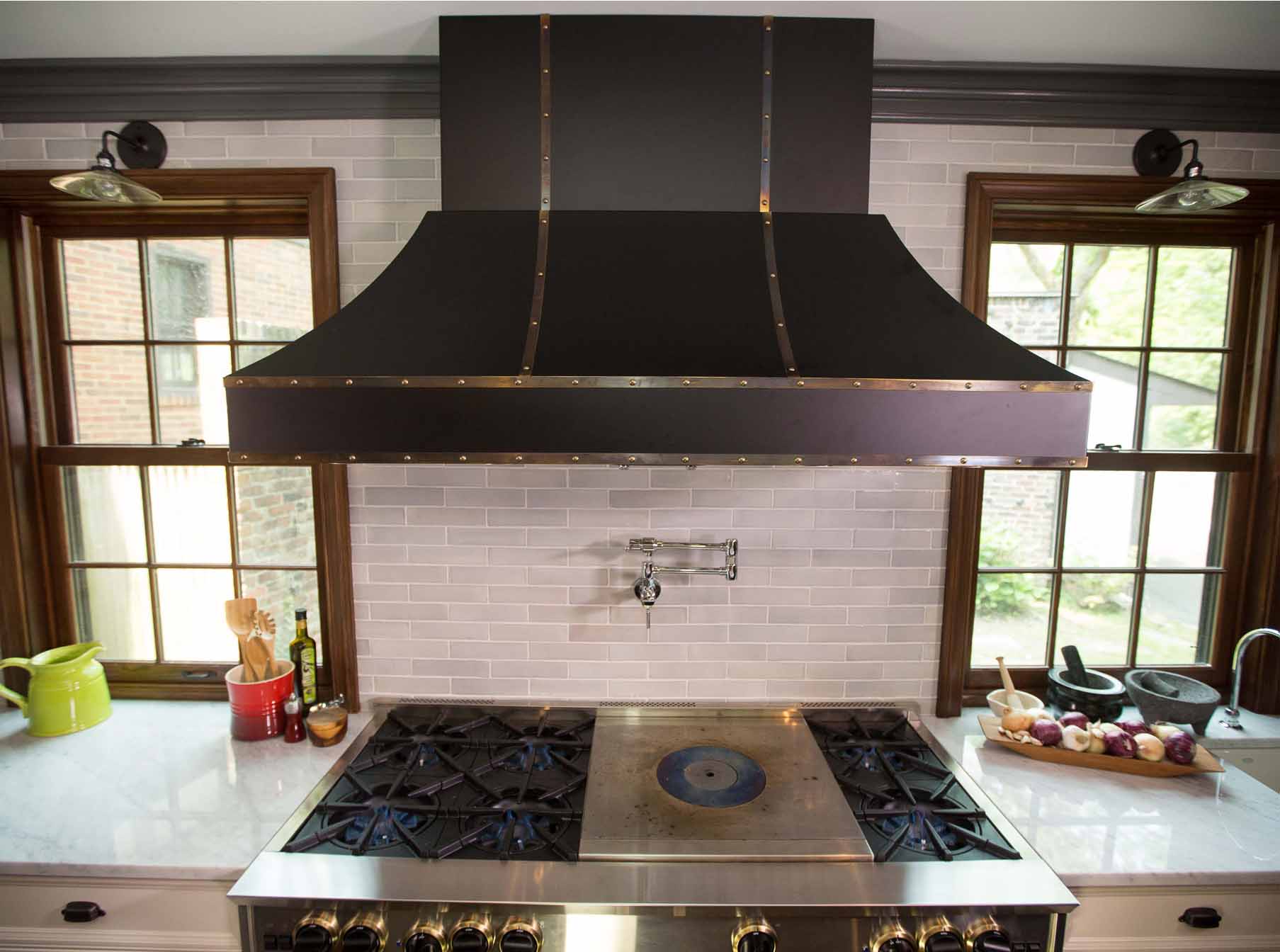 a range hood should be larger than the cooktop for efficiency