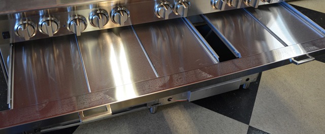 Easy to clean grease trays on a BlueStar range