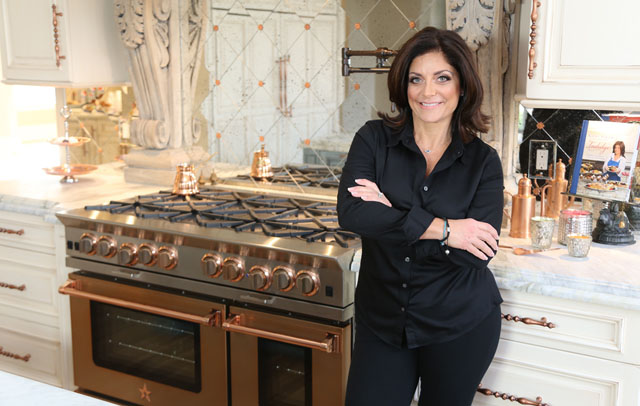 Kathy Wakile with her 48" BlueStar Range in Infused Copper