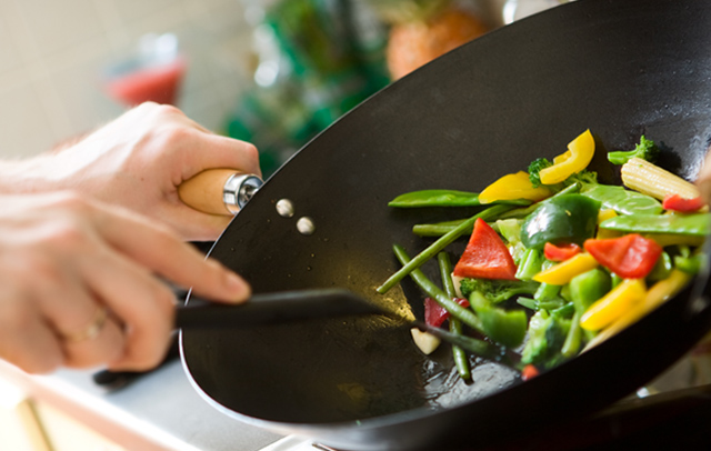 Cooking vegetables in a wok