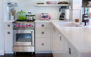 Tiny kitchen featuring a 24-inch freestanding range from BlueStar