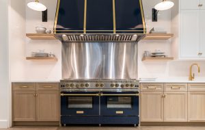 Custom Incline Style Hood in Steel Blue (RAL 5011) with Brushed Brass Trim